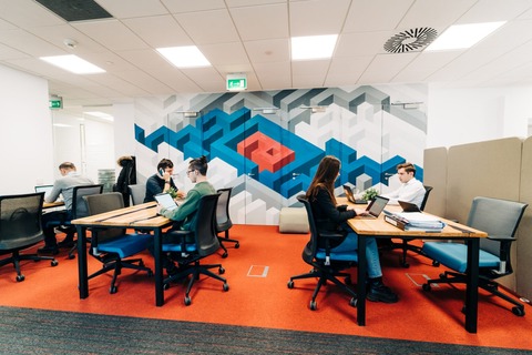 an office with a desk and chair in a room