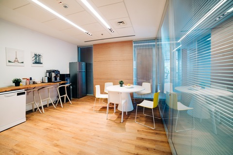 a living room filled with furniture on top of a hard wood floor