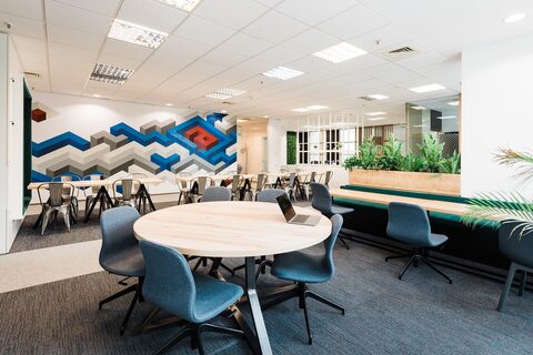 a room filled with furniture and a blue chair