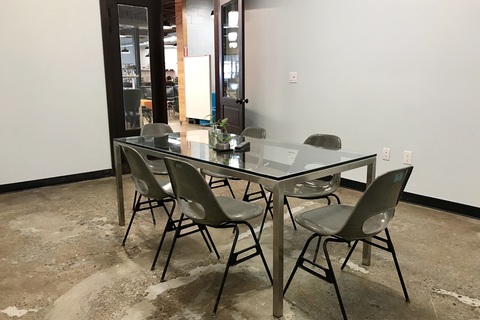 a chair sitting in front of a table