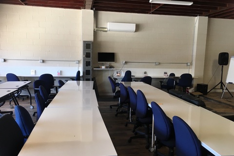 a group of people sitting at a table in a room