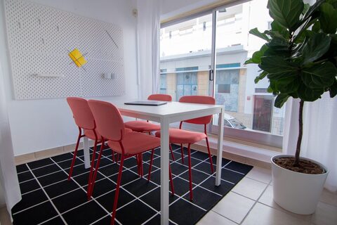 a chair sitting in front of a window