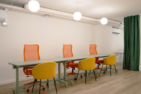 a room with a table and chairs