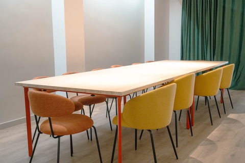 a table with chairs in a room