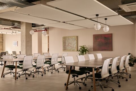 a conference room with a table and chairs