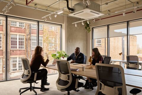 a group of people sitting at a table