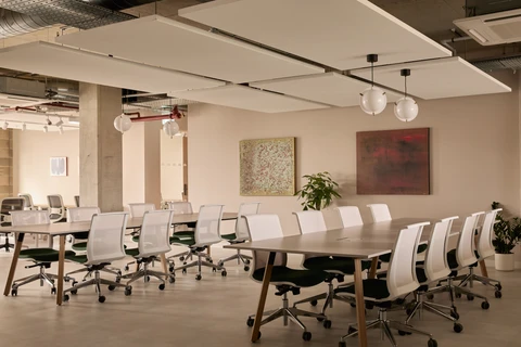 a conference room with a table and chairs