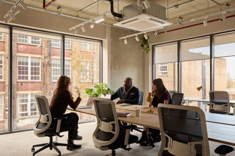 a group of people sitting at a table