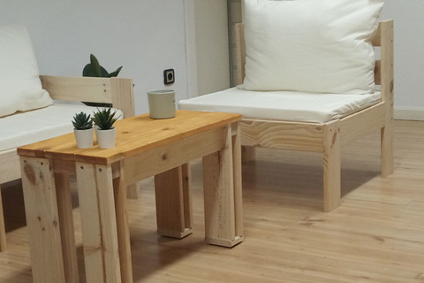 a bedroom with a bed and desk in a room