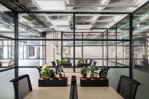 a room filled with furniture and a large window