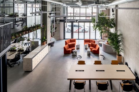 a room filled with furniture and a table in front of a building