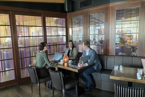 a person sitting at a table in a restaurant