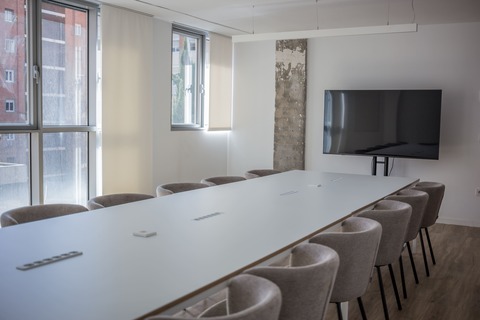 a room with a table and chairs