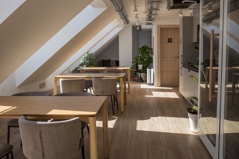 a room with tables and chairs