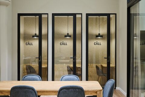 a chair sitting in front of a mirror
