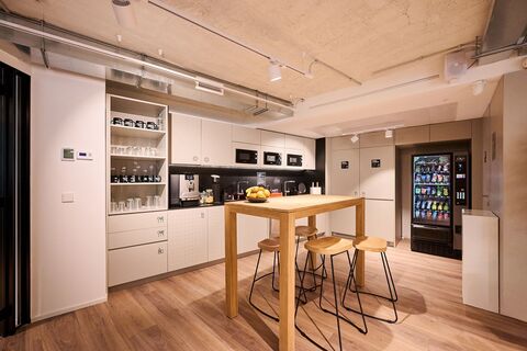 a kitchen with a table in a room