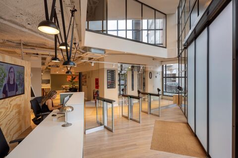 a room filled with furniture and a large window