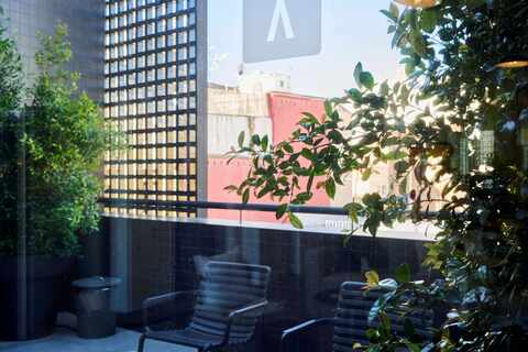 a dining table in front of a building