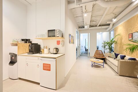 a room filled with furniture and a refrigerator