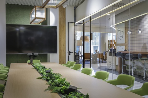 a room filled with furniture and a large window
