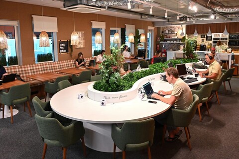 a group of people sitting at a table in a room