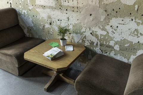 a chair sitting in front of a building