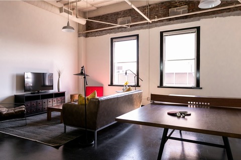 a dining room table in front of a window