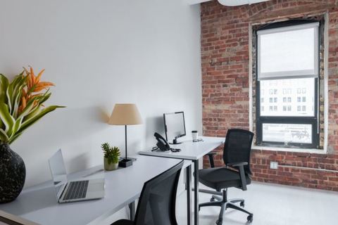 a desk with a chair in a room
