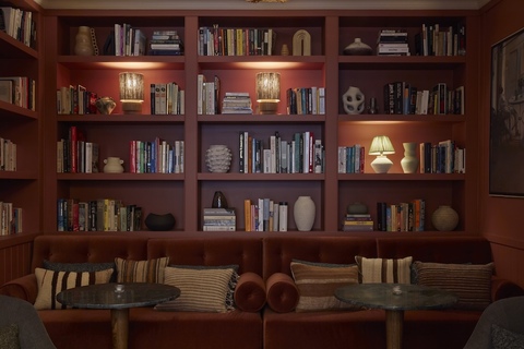 a living room with a book shelf