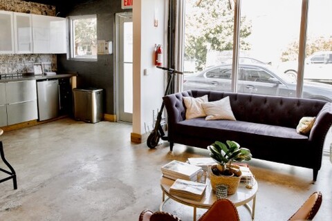 a living room filled with furniture and a fire place