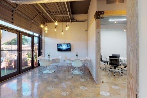 a room filled with furniture and a large window
