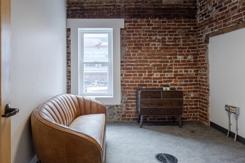 a living room filled with furniture and a fireplace