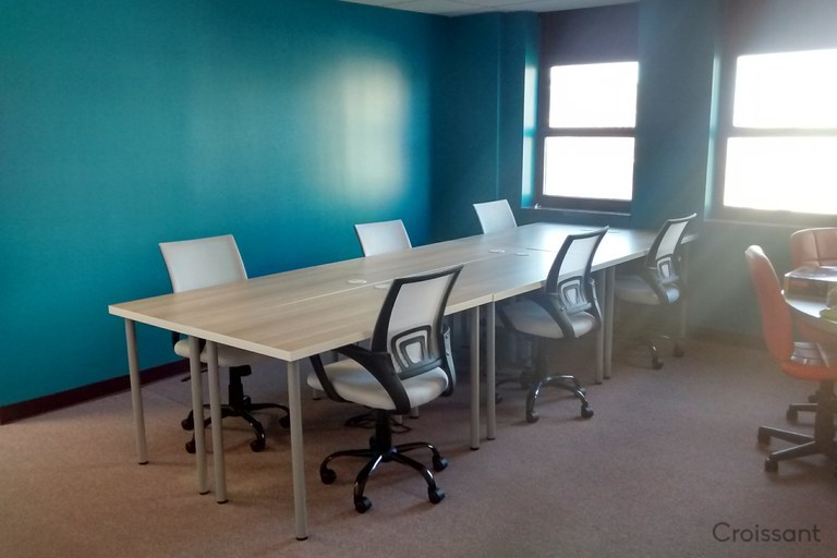 a desk with a chair in a room