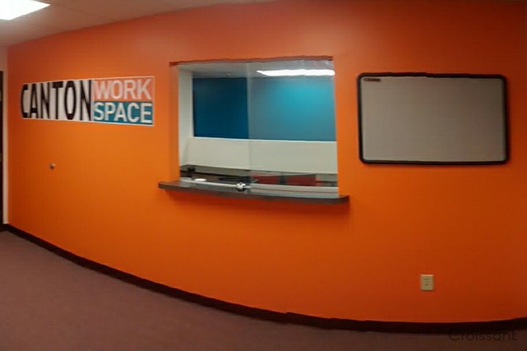 a flat screen tv sitting in a room