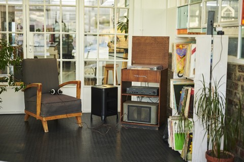 a living room filled with furniture and a large window