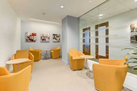 a living room filled with furniture and a box on a table