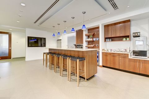 a kitchen with a wood floor in a room