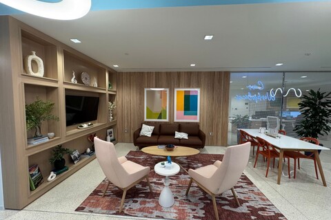 a living room filled with furniture and a large window