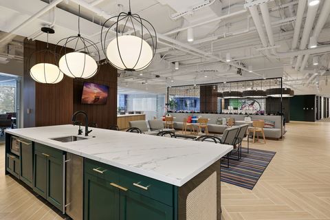 a kitchen with a table and chairs