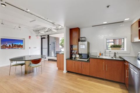 a kitchen with a wood floor in a room