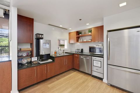 a large kitchen with stainless steel appliances