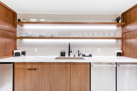 a kitchen with wooden cabinets and a refrigerator