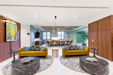 a room filled with furniture and a large window