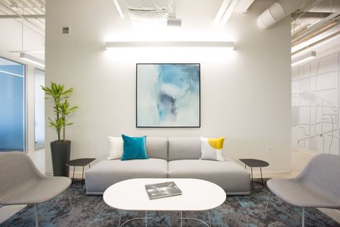 a living room filled with furniture and a flat screen tv