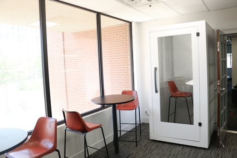 a dining room table in front of a window