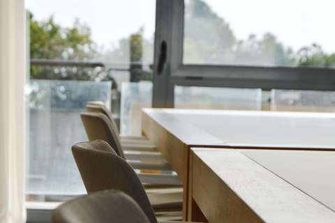 a chair sitting in front of a window