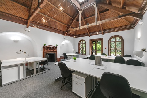 a room filled with furniture and a large mirror