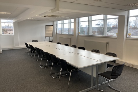 a room filled with furniture and a large window