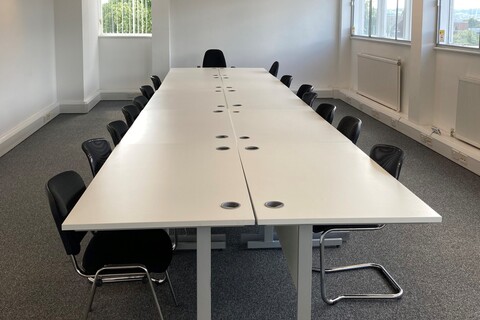 a dining room table in front of a window