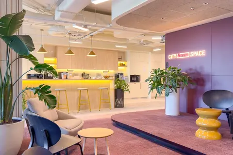 a room with a purple wall and a purple carpet and a pink floor